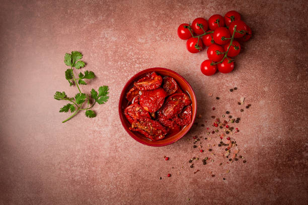 istock dried tomatoes, in a bowl, top view, on a brown background, 1832925952