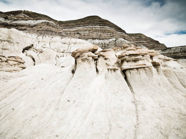 Hoodoos in the Drumheller Valley against summer sky. Drumheller Valley, Badlands, Alberta, Canada.