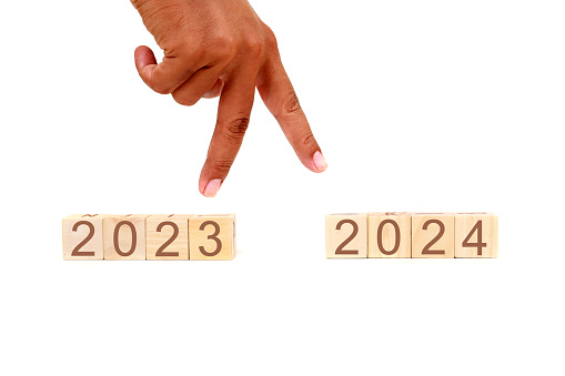 Fingers jump from 2023 to 2024. New year concept