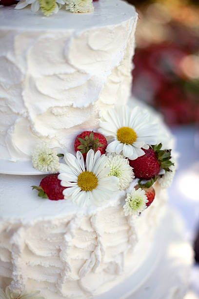istock White wedding cake with berries and flowers 183293144