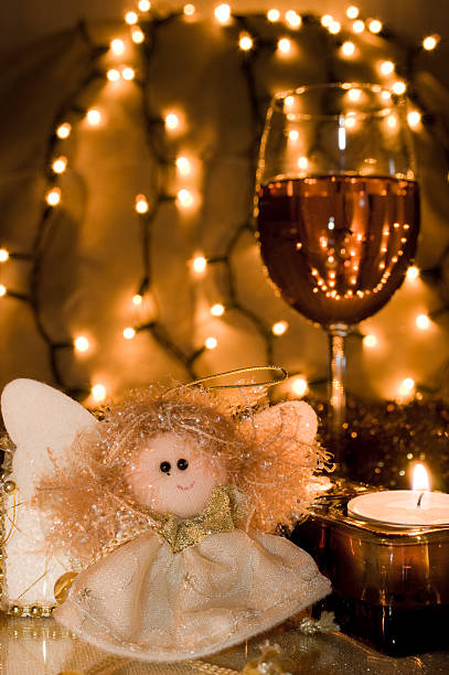 Angel Doll in Front of the Christmas Decoration stock photo