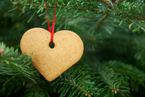 Heart cookie christmas decoration on a christmas tree. Shallow depth of field. Space for text.For more click below: