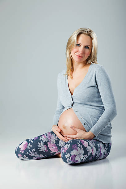 istock Pregnant woman holding her belly 183294090