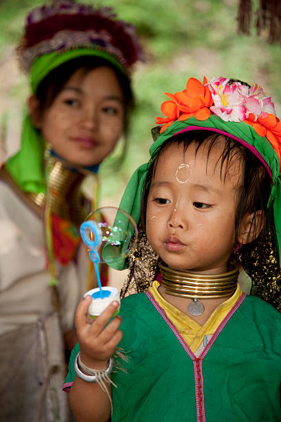 Thailand, traditionally dressed long necked woman and child.  padaung tribe stock pictures, royalty-free photos & images