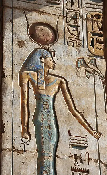 "Ancient carved image of the Egyptian Goddess Isis -  with hieroglyphics at the Medinet Habu templeMedinet Habu is the name commonly given to the Mortuary Temple of Ramesses III, an important New Kingdom period structure in the location of the same name on the West Bank of Luxor in Egypt. Luxor Egypt"