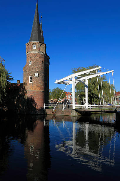 istock Delft's Oostpoort and its reflection in the water 183294263