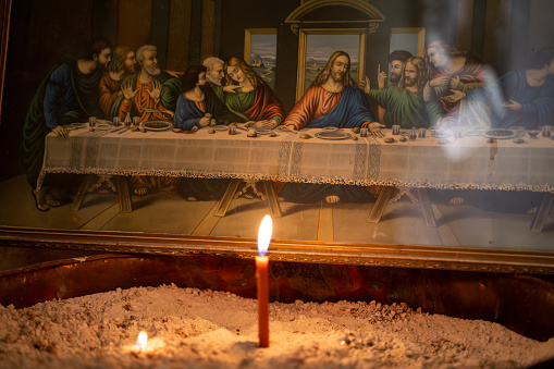 Last Supper table and candle in church. Mardin, Turkey - 30 October 2023.
