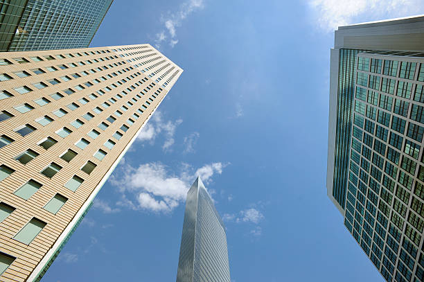 moderni grattacieli in una giornata di sole - shimbashi district skyscraper building exterior low angle view foto e immagini stock