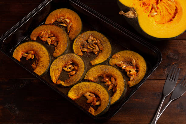 istock Oven-baked pumpkins on a baking sheet top vew 1832955250