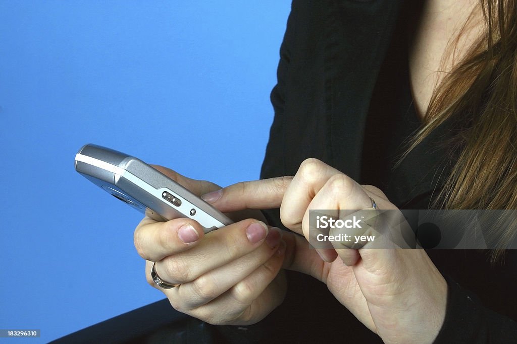 Cellphone in the woman's hands Woman dial a number on her cellphone. Adult Stock Photo