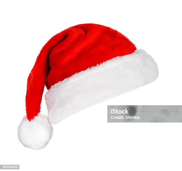 A Festive Red And White Santa Hat On A White Background Stock Photo - Download Image Now