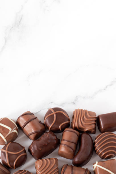 istock Chocolate praline candies on white, top view 1832966825