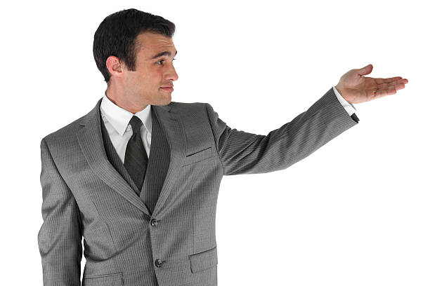 istock Isolated businessman holding arm out to side presenting 183297711