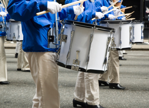 Close-up of a line of marchers playing snare drums in a street parade.Click below to view similar photos and all my music related images: