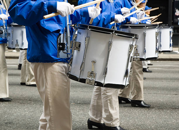 Marching Band Drummers Close-up of a line of marchers playing snare drums in a street parade.Click below to view similar photos and all my music related images: snare drum photos stock pictures, royalty-free photos & images