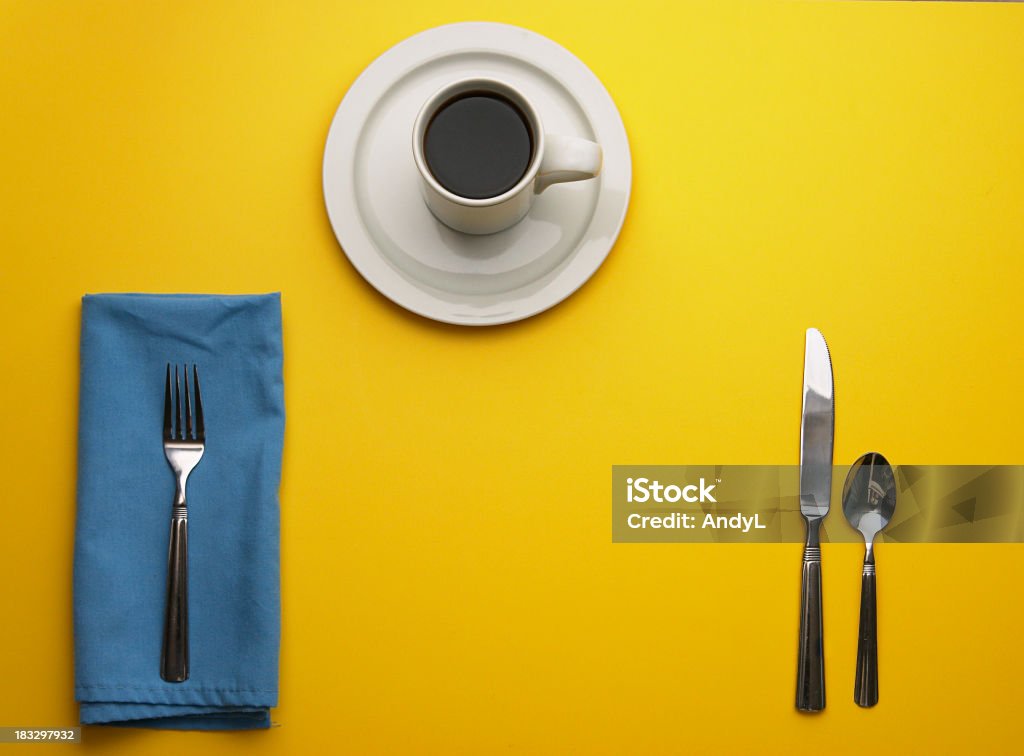 Place Setting on Yellow with Room for Your Plate Yellow Background Stock Photo