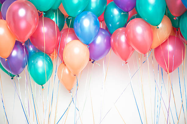 party balloons group of colorful helium party balloons helium balloon stock pictures, royalty-free photos & images