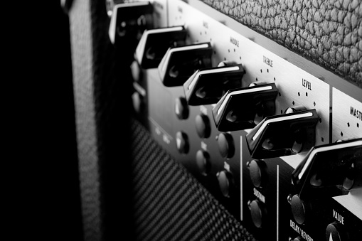 Detail of knobs on a guitar amplifier.
