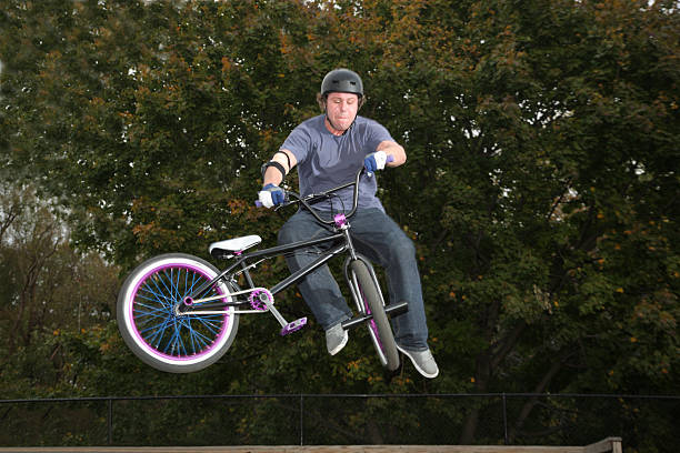 BMX Rider Doing Airborne Stunt stock photo