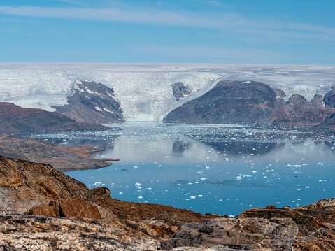 A glacier slides into the sea in a east Greenlandic fjord