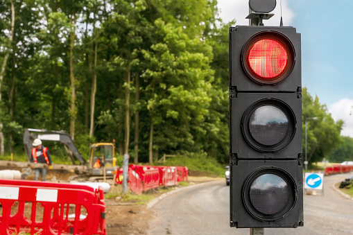 Temporary traffic light installed on road closure due to road works or an accident ahead