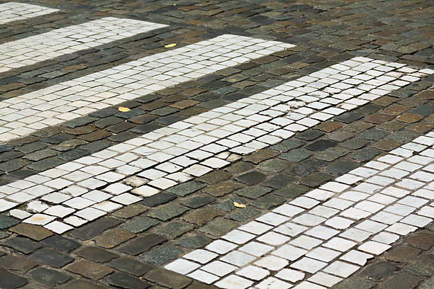 istock Crosswalk / zebra crossing on cobblestone 183299052