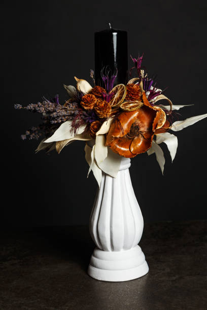 istock Bouquet with a candle and various floral elements 1832990795