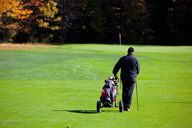 istock Senior Golf Player in Action in Autumn 183299166