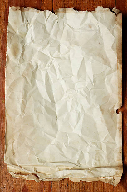 istock Old Paper on Hardwood Floor 183299256