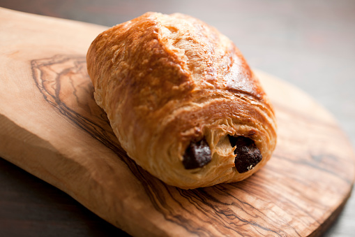 Single Chocolate Croissant, shallow shifted focus.