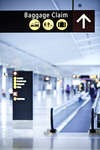 Sign directing travelers to the baggage claim at Seattle-Tacoma International Airport