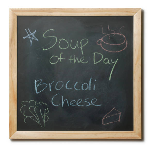 Black board with soup of the day written on it.
