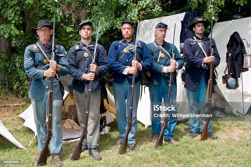 American Civil War Union Soldiers Standing at Attention A group of American Civil War reenactors portraying Union soldiers standing at attention while being addressed by their commanding officer. American Civil War Stock Photo