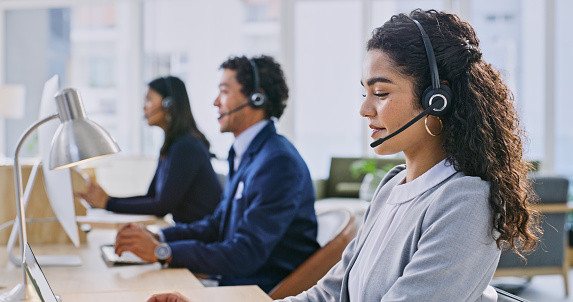 Business people, telemarketing or woman with call center, tech support and communication. Person, consultant and agent with headphones, telecom sales or customer service with crm, smile and help desk