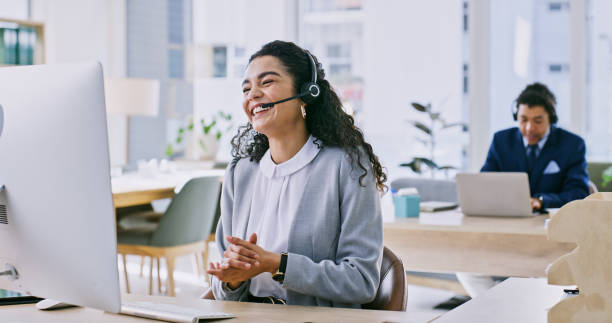 istock Agent, woman and computer for call center communication, customer service and e commerce support in office. Asian advisor or business consultant laughing on desktop with contact us, telecom or sales 1833005829