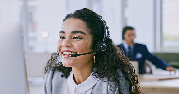 Business woman, happy and call center for communication, customer service or e commerce support on office computer. Professional advisor, virtual assistant or consultant smile for contact us and FAQ