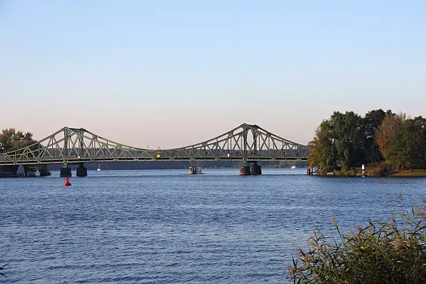 Glienicke Bridge is the bridge which spans the Havel River to connect the cities of Berlin and Potsdam. It was the bridge to exchange captured spies during the Cold War. The Bridge is also a symbol of German Reunification in November 1989.