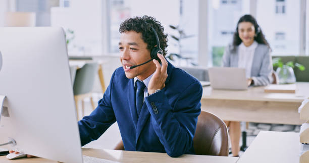 istock Computer, typing and man with call center, customer service and business people with telemarketing, talking and help desk. Staff, office and employees with a pc, tech support and crm with internet 1833006366