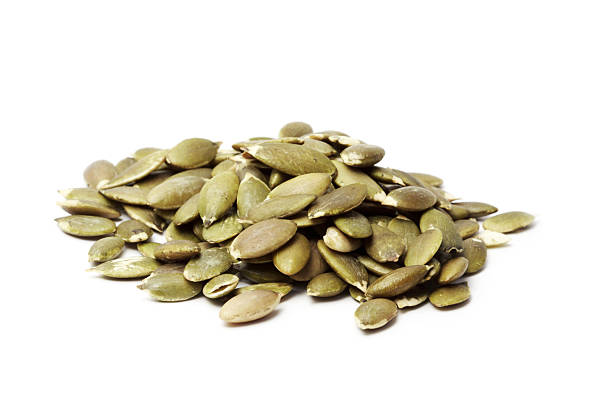 Pumpkin seed isolated on white background stock photo