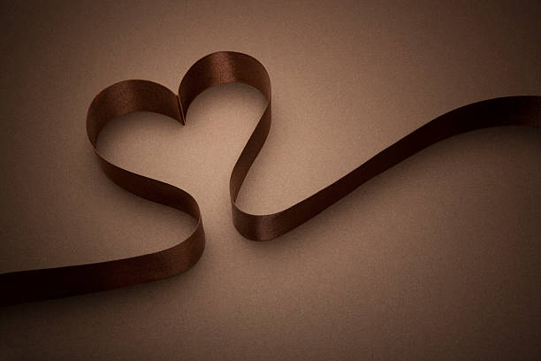 istock Chocolate Brown Heart Shaped ribbon 183300857