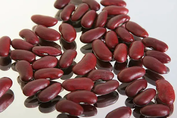 red kidney beans on reflective surface