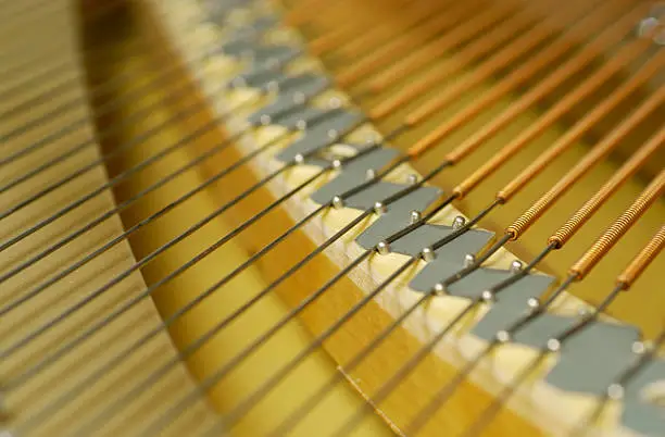 Detail from inside a spinet piano.