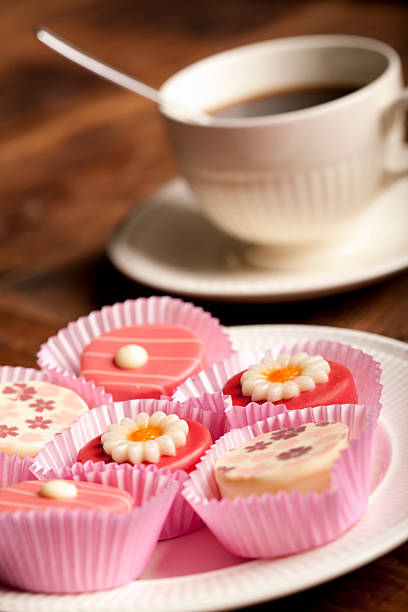 istock cup of coffee with petit fours 183301216