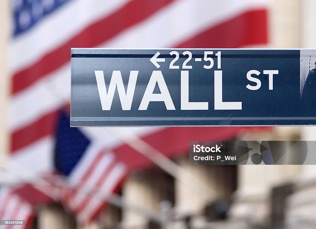 Wall Street-Street Sign This is the actual street sign in front of the New York Stock Exchange. Wall Street - Lower Manhattan Stock Photo