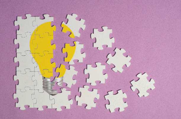 istock Business concept,innovation,ideas Personal development, human resources,recruitment,team building with jigsaw puzzle pieces and lightbulb 1833013682