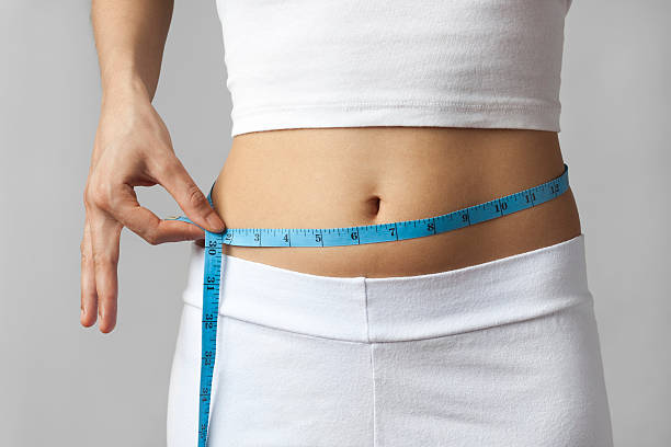 istock Thin woman measuring waist 183301650