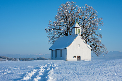 chapel in winter on a frosty snowy evening, germany religious, christmas landscape