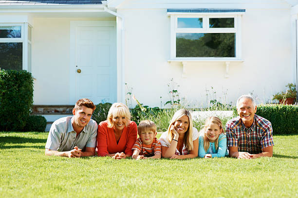 istock Happy family lying on grass and looking at you 183302704
