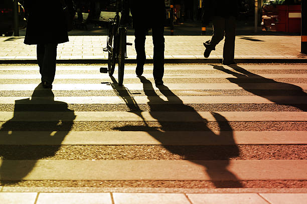 istock Pedestrians on zebra crossing in silhouette 183302842