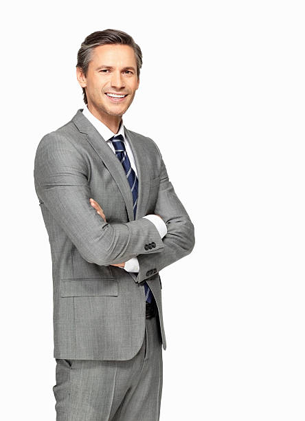 istock Smiling businessman with arms folded against white background 183303208